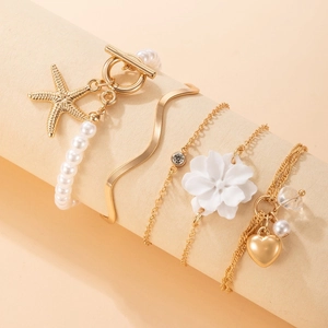 Five-piece multi-layered pearl bracelet set with OT clasp and camellia flower charms