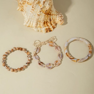 Bohemian jewelry set with beaded bracelet, shell woven cord, and marbled resin bangle