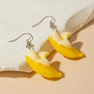 Creative mini banana earrings with realistic peeled fruit design and silver hooks