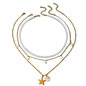 Three-layer ocean theme necklace with white pearls, gold starfish and shell pendants
