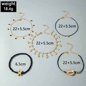 Detail of 5-piece bohemian anklet set with starfish, seashells and size specs