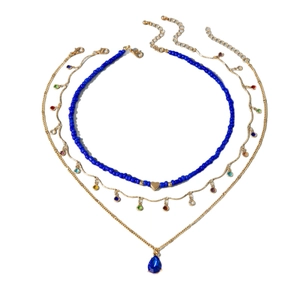 Three-layer stacked necklace set featuring blue beads and a blue water drop pendant