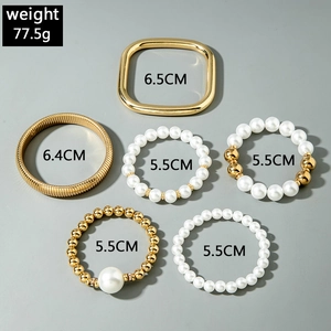 6-piece layered gold bangle and pearl bracelet set with oversized beads for women