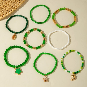 Set of 8 bohemian green beaded bracelets with shell and dolphin charms for beach wear
