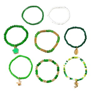 Set of 8 bohemian green beaded stretch bracelets with shell and dolphin charms
