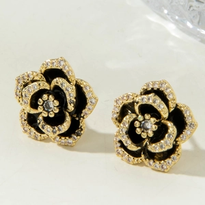 Classic camellia flower stud earrings with black enamel and sparkling white crystals