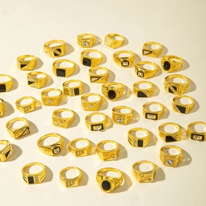 Golden 10-piece alloy ring set with black gemstones and sparkling rhinestones