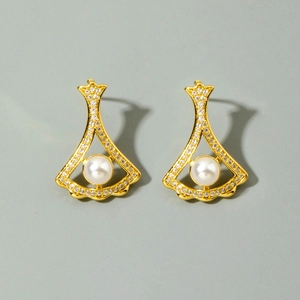Elegant gold fan-shaped stud earrings with micro-pave diamonds and central white pearl
