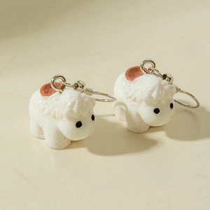 Detailed view of creative 3D cartoon animal earrings featuring a cute white pony design