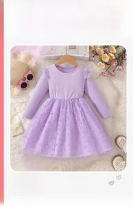 Detail of light purple girls' dress with knit bodice and tiered polka dot mesh skirt