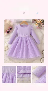 Detail of purple long-sleeved girls' dress with polka dot mesh layers and ribbed texture