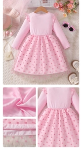 Detail of pink knitted bodice and layered tulle skirt with polka dots for girls