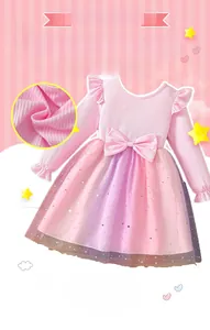 Detail of pink long sleeve girl dress with sequined rainbow mesh tulle and bow
