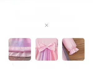 Detailed view of pink mesh skirt with silver stars, bow waist, and ruffled sleeve cuffs