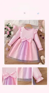 Close-up of pink knit bodice with layered rainbow tulle skirt and glittery star patterns