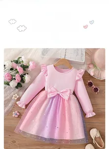 Detail of pink knit bodice with ruffled sleeves and gradient glitter star mesh skirt