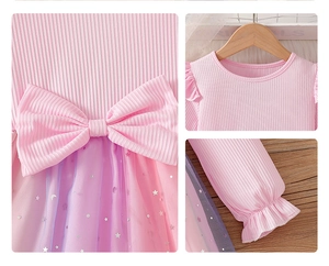 Close-up of girl's dress with pink rib-knit bodice, sequined bow and mesh detail