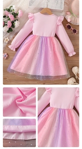 Detail of girls' rainbow gradient mesh skirt with silver star and moon patterns