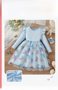 Close-up of girls light blue dress with butterfly mesh skirt and ribbed bodice detailing