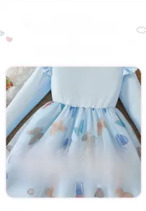 Detail of light blue girls' dress with striped cotton top and butterfly mesh skirt