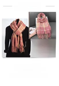 Detail view of pink and beige houndstooth scarf with soft fringe and warm cashmere feel