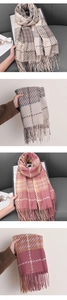 Detailed close-up of soft houndstooth plaid scarf fringe and warm cashmere texture