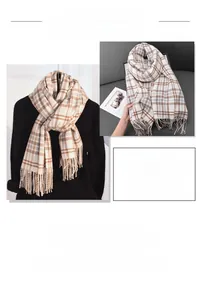 Detail of classic plaid scarf featuring thick cashmere-like texture and soft tassels