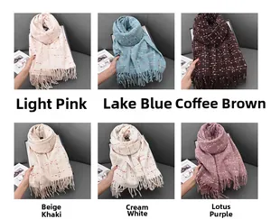 Close-up of cashmere-like fringed scarves in six plaid colors for autumn and winter