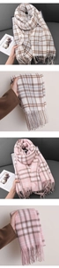 Close-up of thick winter scarf with rice grain pattern, plaid design and tassels