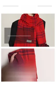 Detail shot of classic red plaid scarf with fringe edges and elegant woven label