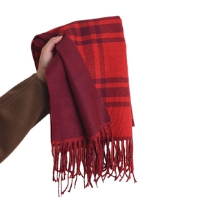 Classic red and black plaid faux cashmere scarf with tassels on a white background