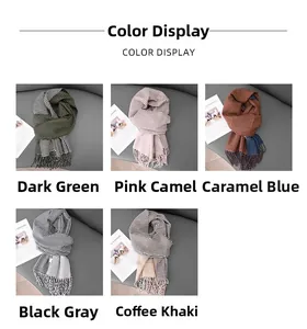 Detail showing five houndstooth scarves with fringe in various autumn and winter colors
