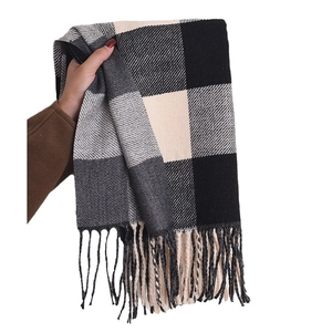 Classic plaid tassel scarf in black and white check pattern made of soft knit fabric