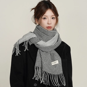 Classic black and white houndstooth scarf with long tassels and elegant label detail