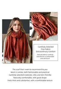 Detail of caramel pleated cashmere-like scarf showing vertical stripes and fringe