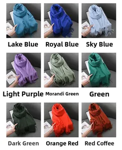 Collection of soft cashmere-feel scarves in nine colors featuring fringe edge details