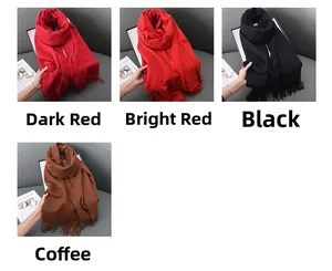 Detail view of winter cashmere feel scarves in red, black, and coffee with tassel fringe