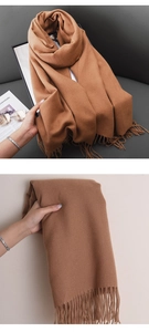 Detail showing soft cashmere-like texture and fringed edges of the brown winter shawl