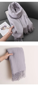 Detailed view of mauve cashmere feel scarf with soft fringes and fine texture
