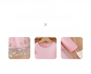 Detail of pink floral embroidery on mesh skirt with soft ruffled sleeve lace trim