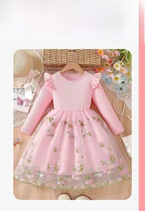 Close-up of pink girls' dress with knit bodice and floral embroidered mesh skirt