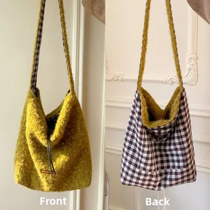Detail showing the reversible design with yellow plush fur and brown checkered fabric