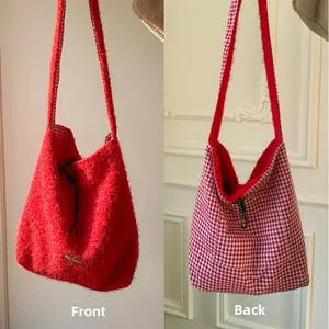 Dual-sided crossbody bag with red faux fur and red-white checkered pattern detail