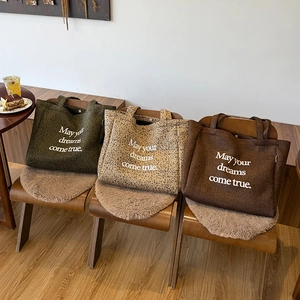 Three oversized suede leopard print tote bags in olive green, beige, and dark brown colors
