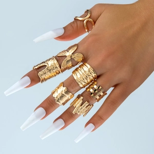 Set of gold-plated hollow geometric rings featuring butterfly and irregular textured designs