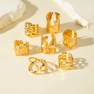 Set of 7 gold minimalist hollow rings featuring irregular lava texture and butterfly design