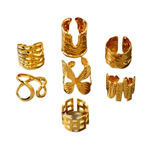 7-piece gold hollow ring set with butterfly and lava patterns in adjustable open design