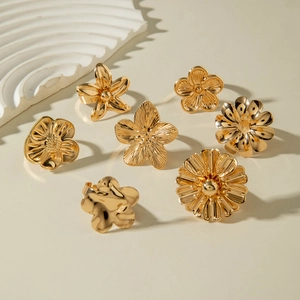 Retro gold flower rings set of seven including sunflower and daisy designs for stacking