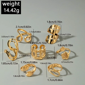 Set of 7 gold-toned rings featuring flower leaf and abstract wave designs with measurements