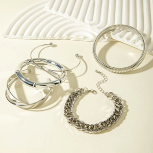 Silver multi-layer punk bracelet set featuring chunky curb chain and metal cuffs